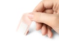 Woman putting sticking plaster on background. First aid item