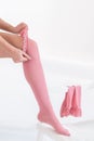 Woman putting thrombosis stockings on Royalty Free Stock Photo