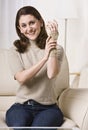 Woman Putting on Wrist Brace Royalty Free Stock Photo