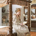 Woman, queen and book with portrait for renaissance, royalty aesthetic and reading in palace bedroom. Monarch, wealthy Royalty Free Stock Photo