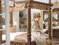 Woman, queen and book with reading for renaissance, royalty aesthetic and confidence on palace bed. Monarch, wealthy Royalty Free Stock Photo