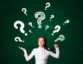 Woman with question marks Royalty Free Stock Photo