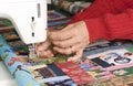Woman quilter using manual thread cutter Royalty Free Stock Photo