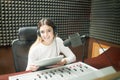 Woman radio broadcaster at recording studio