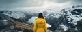 woman in rain jacket by lake in the mountains AI generated Royalty Free Stock Photo