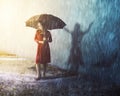 Woman in rain storm with shadow Royalty Free Stock Photo