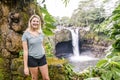 A Woman at The Rainbow Falls, Hilo, Wailuku River State Park, Big Island, Hawaii Royalty Free Stock Photo