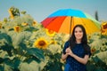 Woman with Rainbow Umbrella in Summer Sunflower Field Royalty Free Stock Photo