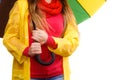 Woman in rainproof coat under umbrella