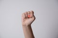 Woman raised fist, or the clenched fist,  isolated on white background Royalty Free Stock Photo