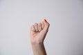 Woman raised fist, or the clenched fist,  isolated on white background Royalty Free Stock Photo