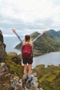 Woman raised hands on mountain top hiking in Norway travel adventure vacations Royalty Free Stock Photo