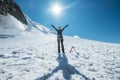 The woman raised her arms and cheerfully smiling while ascending Mont Blanc Monte Bianco summit dressed in mountaineering