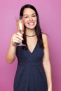 Woman raising a glass of champagne