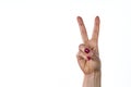 Woman raising two fingers up on hand it is shows peace strength fight or victory symbol and letter V in sign language on white