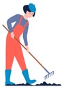 Woman raking soil. Gardening ground. Farm character