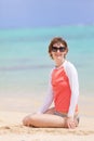Woman in rashguard at the beach Royalty Free Stock Photo