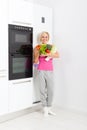 Woman raw fresh vegetables refrigerator