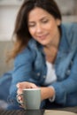 woman reaching for coffee cup Royalty Free Stock Photo