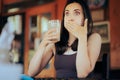 Woman Reacting after Drinking a Sour Beverage