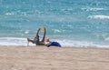 A woman read a book while sunbathing in El Arenal beach in Mallorca wide