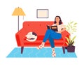 Woman read books sitting on sofa with cat Royalty Free Stock Photo