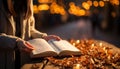 A woman reading the Bible, finding spirituality in the night generated by AI Royalty Free Stock Photo