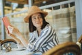 Woman reading a book at a cafe Royalty Free Stock Photo