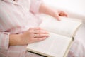 woman reading a book close up