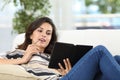 Woman reading a book in an ebook Royalty Free Stock Photo