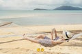 Woman reading a book on hammock beach in free time summer holiday Royalty Free Stock Photo