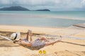 Woman reading a book on hammock beach in free time summer holiday Royalty Free Stock Photo