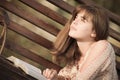 Woman reading a book lying on the bench Royalty Free Stock Photo