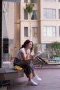 Woman reading a book near the water pool Royalty Free Stock Photo