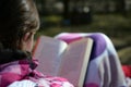 Woman reading a book outdoor