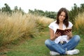 Woman reading book outdoors Royalty Free Stock Photo