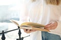 Woman reading book outdoors on sunny day Royalty Free Stock Photo