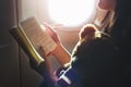 Woman Reading Book Plane Flying Concept