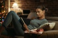 Woman reading a book she received as gift Royalty Free Stock Photo