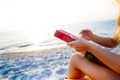 Woman reading book relaxed in deck chair Royalty Free Stock Photo