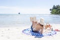 Woman is reading a book on beach Royalty Free Stock Photo