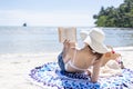 Woman is reading a book on beach Royalty Free Stock Photo