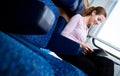 Woman reading a book while on a train Royalty Free Stock Photo