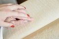 Woman reading braille text on old book Royalty Free Stock Photo