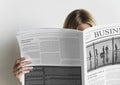 A woman reading business newspaper Royalty Free Stock Photo