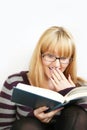 Woman reading with cup Royalty Free Stock Photo