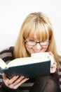 Woman reading with cup Royalty Free Stock Photo