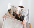 Woman reading Die Zeit with Emmanuel Macron and Marine Le Pen on Royalty Free Stock Photo