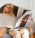 Woman reading Die Zeit with Marine Le Pen and Miss America Royalty Free Stock Photo