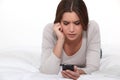 Woman reading disturbing text message